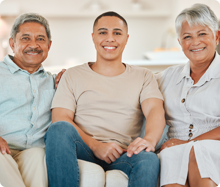 Multigenerational family smiling together representing family-based immigration and reunification
