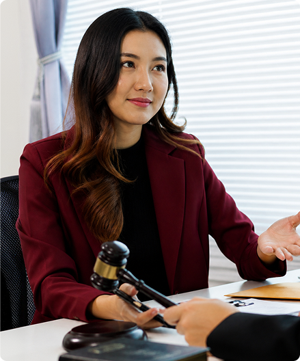 Female immigration lawyer consulting client in office