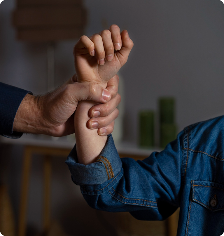 Domestic violence and abuse awareness concept with hand gripping woman’s wrist