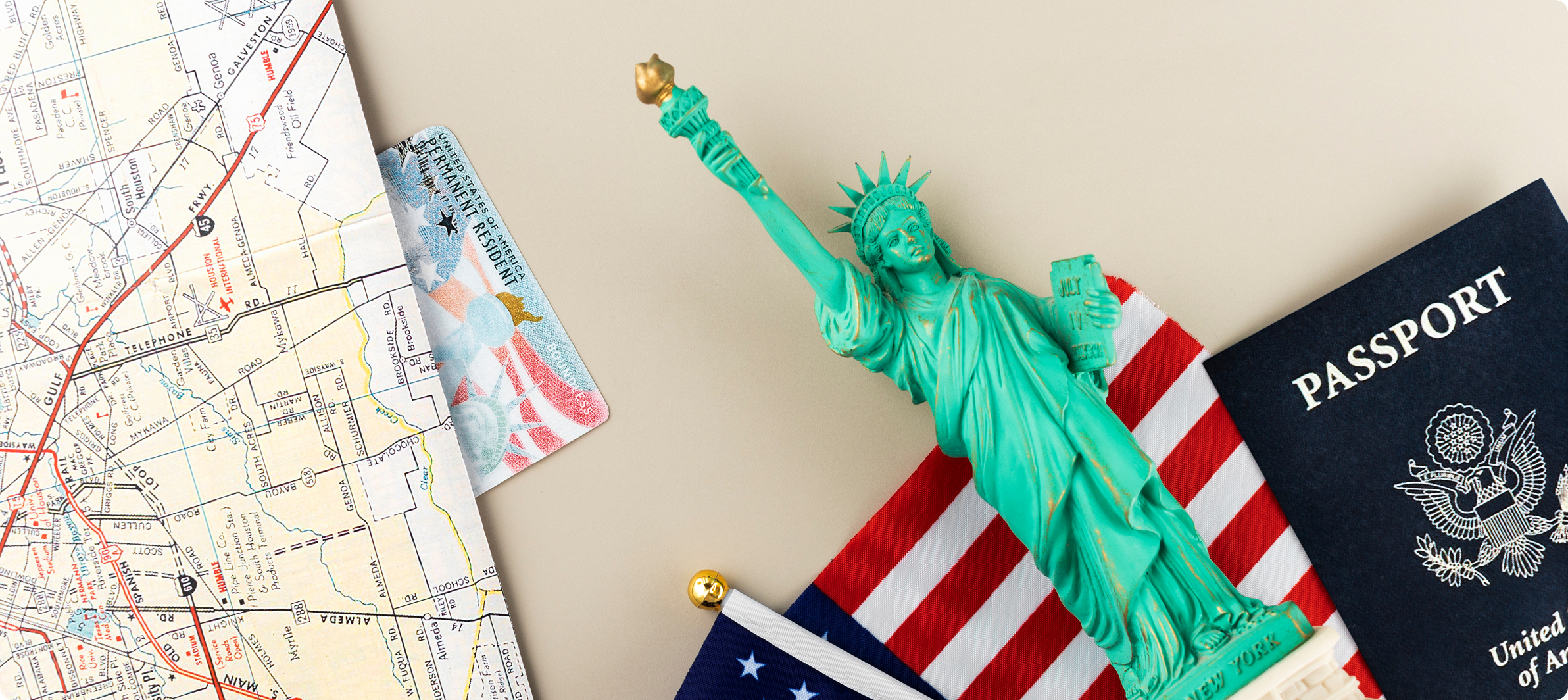 U.S. passport, Green Card, and Statue of Liberty symbolizing immigration services, permanent residency, and citizenship applications.