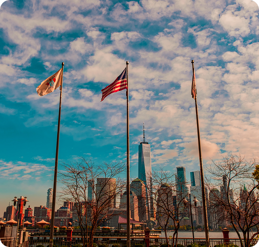 United States skyline with American flags representing U.S. immigration opportunities and visa services