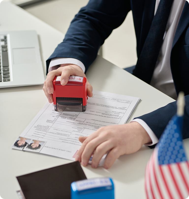 Immigration lawyer reviewing and approving visa application documents for a client