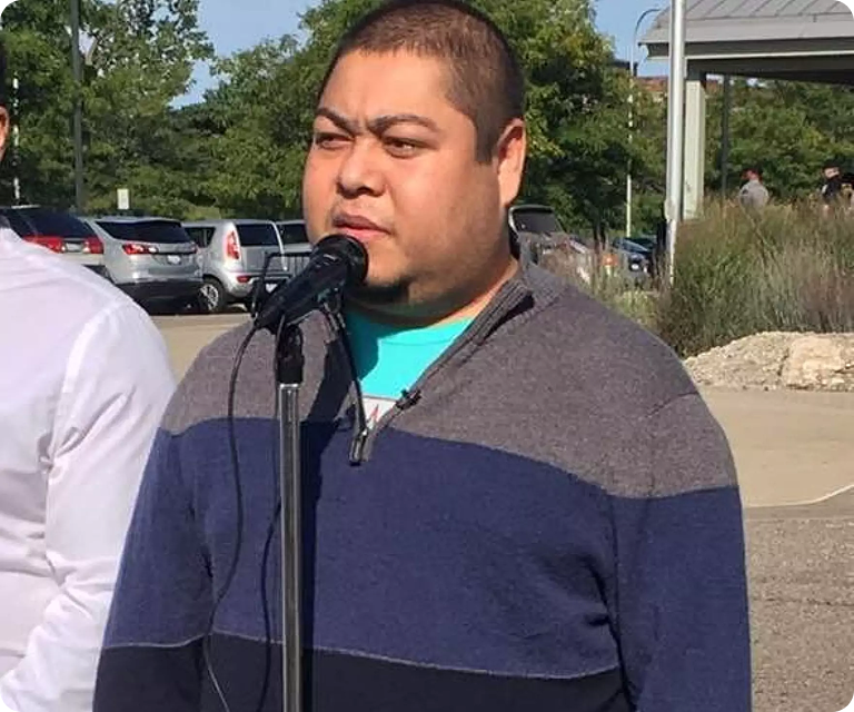 Community member sharing personal immigration story during a U.S. immigration advocacy event