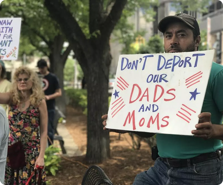 Family advocating against deportation while seeking immigration legal assistance and family reunification